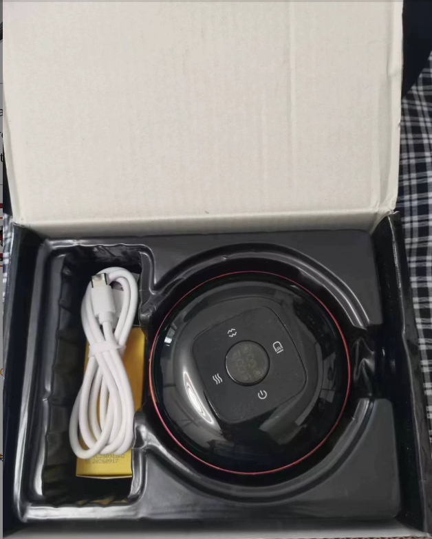 Cupping massager in its box with USB cable